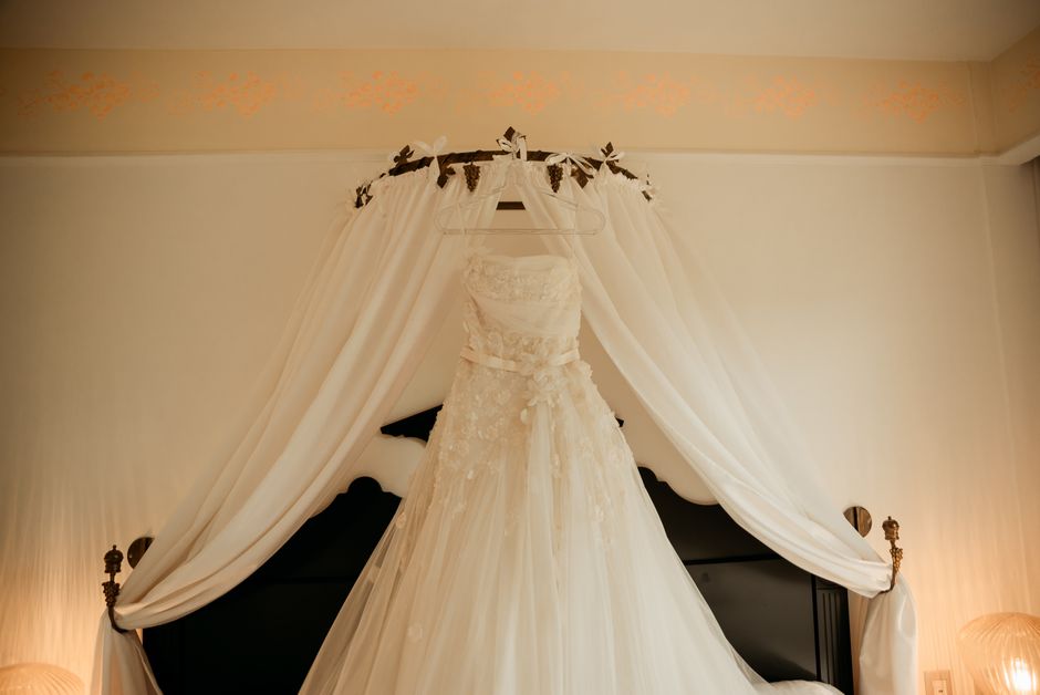 Elegant wedding dress hanging before the ceremony